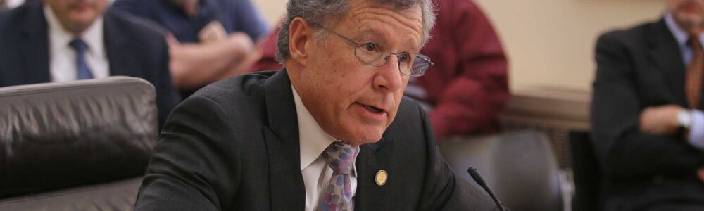 Nebraska state Senator John McCollister speaking at a Nebraska Legislature committee hearing.
